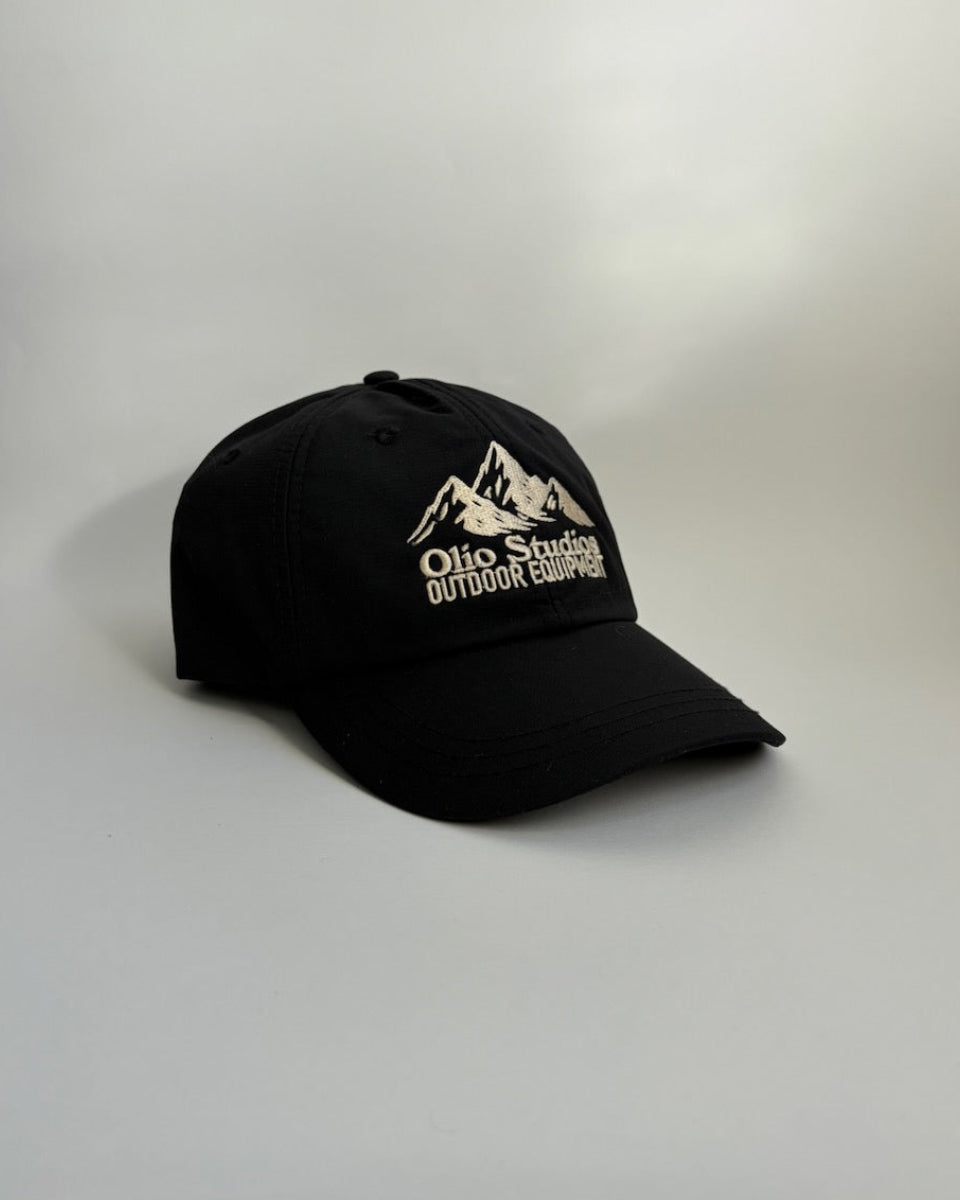 Black cap with mountain logo and text on a white background